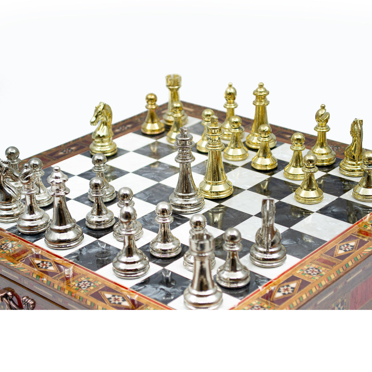 Detailed view of the weighted metal chess pieces on the wooden board - Chess studio
